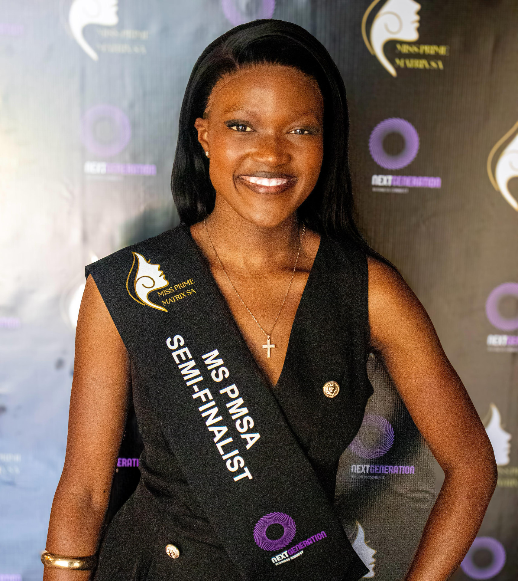 Prime Matrix semi-finalist smiling in her official sash